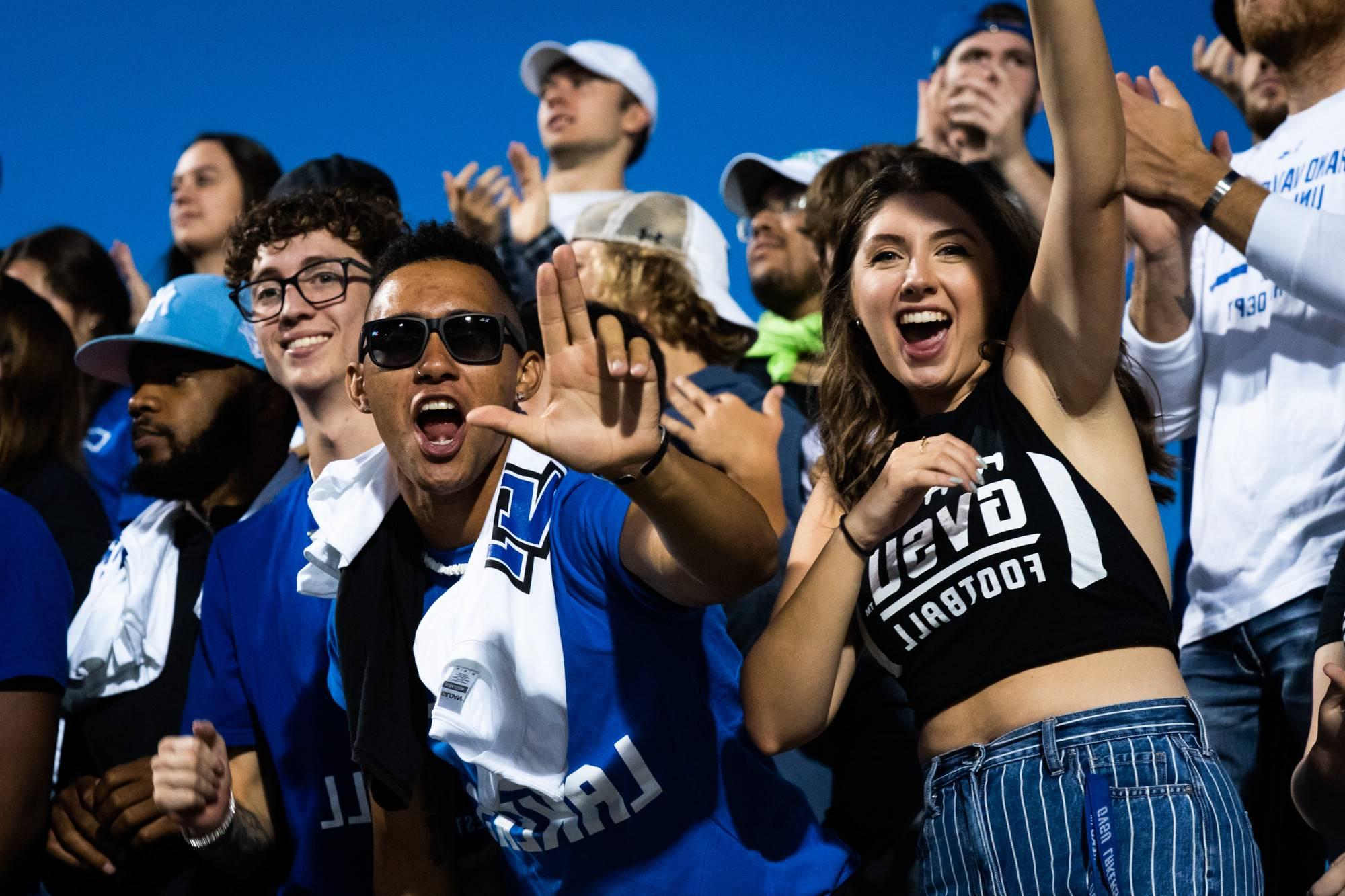 Students cheer on the GVSU football team from the stands in Lubbers Stadium